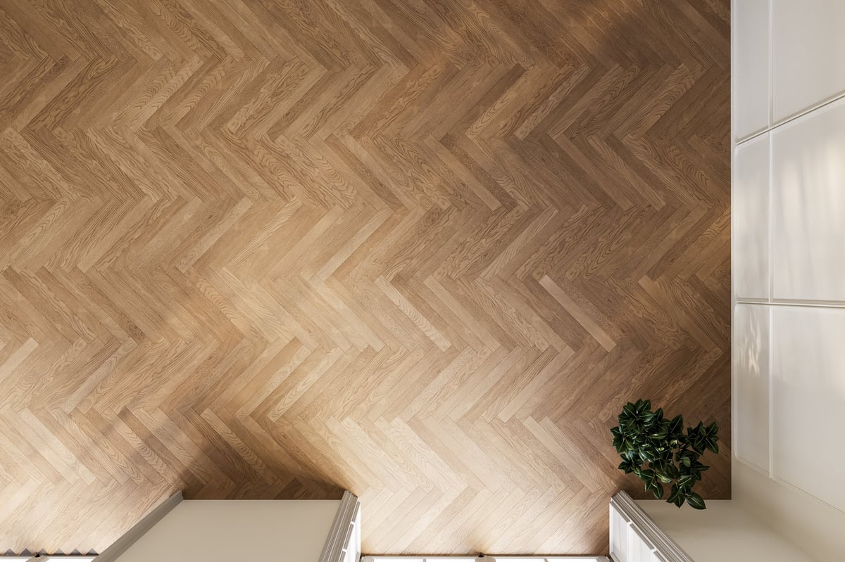 Herringbone wooden floor with warm tones